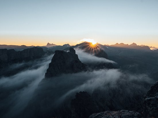 Holidays in the Dolomites – holidays at Sensoria Dolomites Sunrise over misty mountains with clear sky